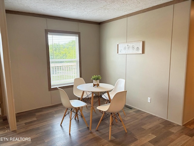 4501 Shipe Rd, Corryton, TN 37721 - dining space featuring wood finished floors, a textured ceiling, and baseboards