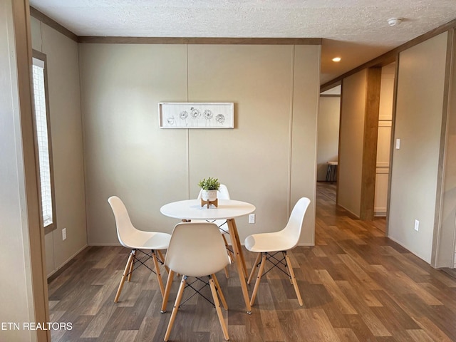 4501 Shipe Rd, Corryton, TN 37721 - dining area with wood finished floors, a textured ceiling, and baseboards
