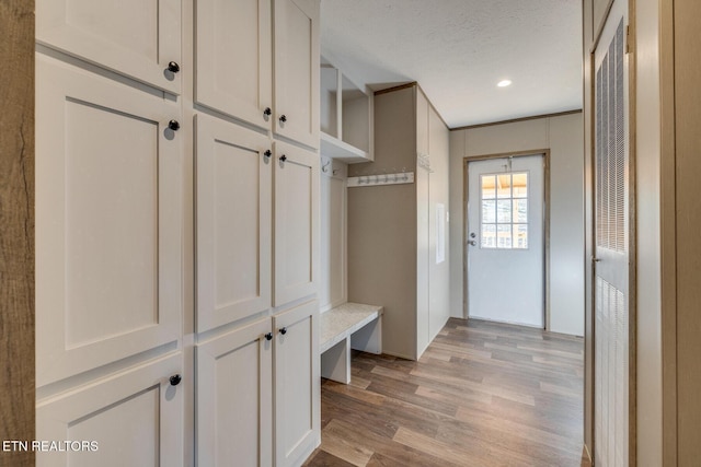 4501 Shipe Rd, Corryton, TN 37721 - mudroom featuring light wood finished floors, a textured ceiling, recessed lighting, and a heating unit