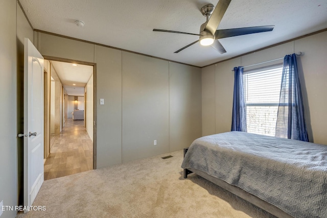4501 Shipe Rd, Corryton, TN 37721 - carpeted bedroom featuring ornamental molding, a decorative wall, ceiling fan, and a textured ceiling