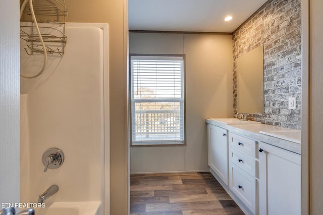 4501 Shipe Rd, Corryton, TN 37721 - full bathroom with double vanity, plenty of natural light, wood finished floors, and bathing tub / shower combination