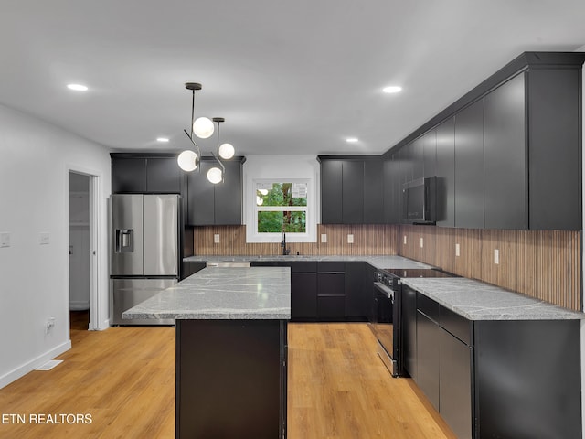 9501 E Aiken Ln, Knoxville, TN 37922 - kitchen featuring stainless steel refrigerator with ice dispenser, electric range oven, decorative backsplash, a kitchen island, and pendant lighting