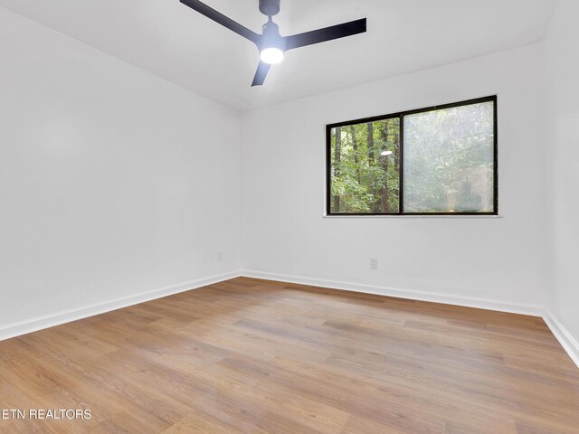 9501 E Aiken Ln, Knoxville, TN 37922 - empty room featuring ceiling fan, light wood-type flooring, and baseboards