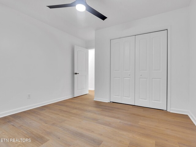 9501 E Aiken Ln, Knoxville, TN 37922 - unfurnished bedroom with baseboards, light wood-style flooring, a closet, and ceiling fan