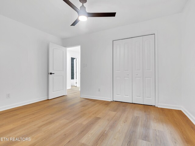 9501 E Aiken Ln, Knoxville, TN 37922 - unfurnished bedroom featuring baseboards, light wood-type flooring, a closet, and a ceiling fan
