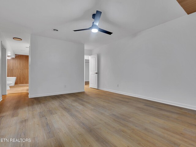 9501 E Aiken Ln, Knoxville, TN 37922 - spare room featuring wood finished floors, baseboards, and a ceiling fan