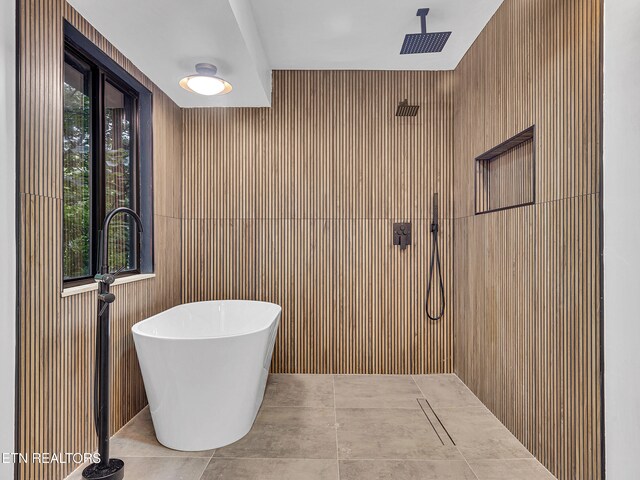 9501 E Aiken Ln, Knoxville, TN 37922 - full bathroom featuring a freestanding bath, a shower, tile patterned flooring, and wooden walls