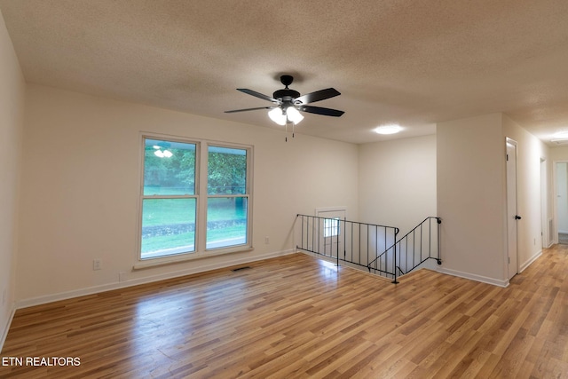 2800 Boyds Bridge Pike, Knoxville, TN 37914 - spare room with light wood-style flooring, a textured ceiling, baseboards, and ceiling fan