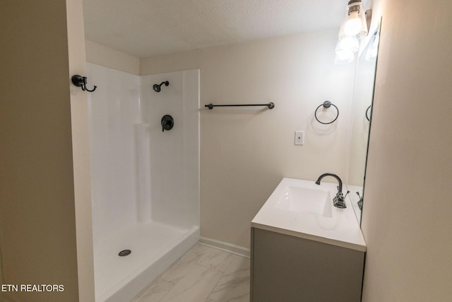 2800 Boyds Bridge Pike, Knoxville, TN 37914 - bathroom with vanity, marble look tiles, a shower, and a textured ceiling