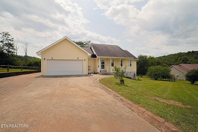 773 Harvest Meadows Dr, Kodak, TN 37764 - ranch-style home with driveway, a garage, and a front yard
