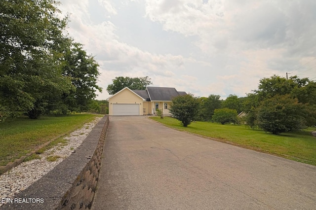 773 Harvest Meadows Dr, Kodak, TN 37764 - view of front of home with driveway, a front lawn, and a garage