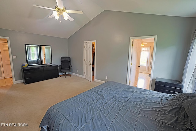 773 Harvest Meadows Dr, Kodak, TN 37764 - carpeted bedroom with vaulted ceiling, baseboards, ceiling fan, and a walk in closet