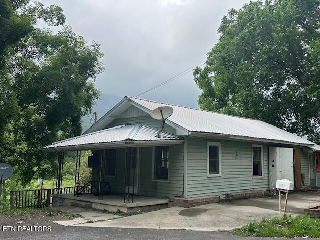 1377 Dr Thomas Walker Rd, Ewing, VA 24248 - view of front of home featuring covered porch and metal roof