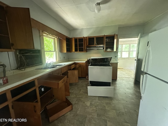 1377 Dr Thomas Walker Rd, Ewing, VA 24248 - kitchen featuring freestanding refrigerator, under cabinet range hood, open shelves, light countertops, and brown cabinets