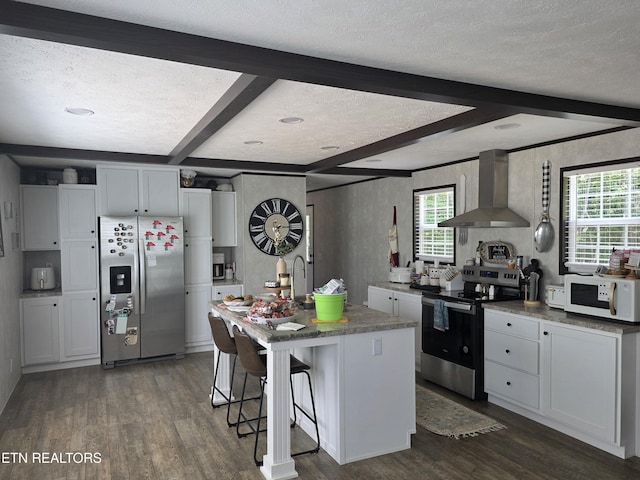 437 Clint Williams Rd, Rutledge, TN 37861 - kitchen featuring appliances with stainless steel finishes, wall chimney exhaust hood, dark wood-style flooring, a textured ceiling, and beam ceiling