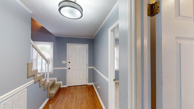 103 Mayfield Dr Unit 5, Elizabethton, TN 37643 - doorway with wood finished floors, stairs, ornamental molding, and baseboards
