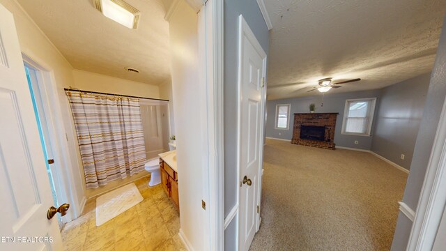 103 Mayfield Dr Unit 5, Elizabethton, TN 37643 - full bath featuring ceiling fan, vanity, a fireplace, a shower with curtain, and toilet