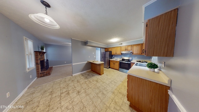 103 Mayfield Dr Unit 5, Elizabethton, TN 37643 - kitchen featuring appliances with stainless steel finishes, light countertops, under cabinet range hood, baseboards, and a sink