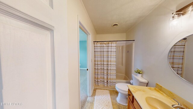 103 Mayfield Dr Unit 5, Elizabethton, TN 37643 - bathroom featuring vanity, toilet, shower / bath combination with curtain, and a textured ceiling