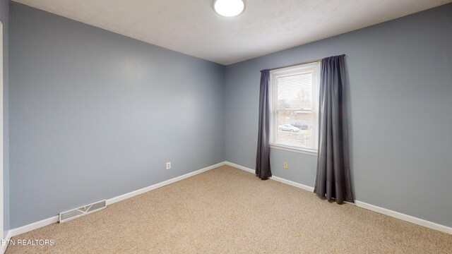 103 Mayfield Dr Unit 5, Elizabethton, TN 37643 - unfurnished room with light carpet and baseboards