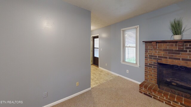 103 Mayfield Dr Unit 5, Elizabethton, TN 37643 - unfurnished living room with baseboards, carpet floors, and a fireplace