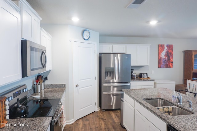 5049 Cottonseed Way, Morristown, TN 37813 - kitchen with stainless steel appliances, a sink, dark wood finished floors, white cabinets, and light stone counters