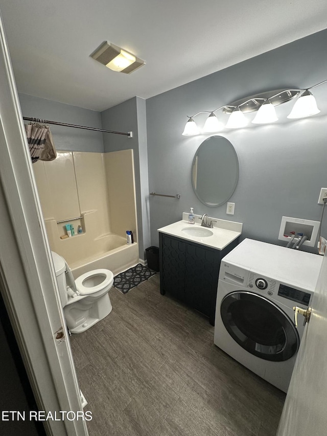 365 Moytoy Rd Unit 103, Crab Orchard, TN 37723 - full bath featuring washer / clothes dryer, tub / shower combination, vanity, and wood finished floors