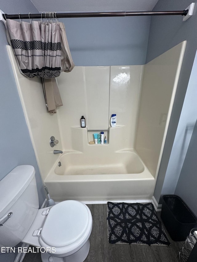 365 Moytoy Rd Unit 103, Crab Orchard, TN 37723 - bathroom with shower / tub combo with curtain and wood finished floors