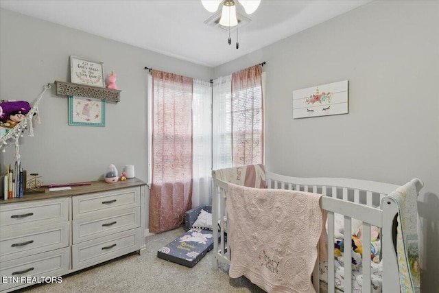 573 Patterson Rd, Harrogate, TN 37752 - bedroom featuring a crib, light colored carpet, and a ceiling fan
