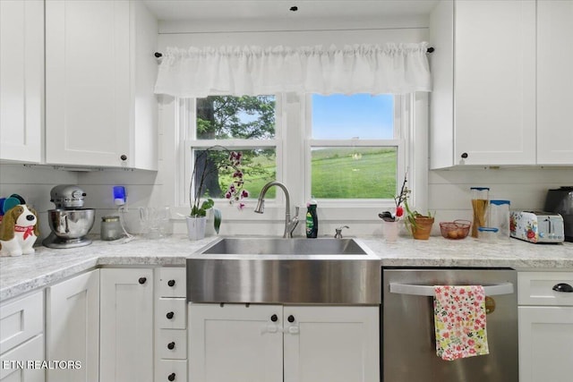 573 Patterson Rd, Harrogate, TN 37752 - kitchen with stainless steel dishwasher, a sink, white cabinetry, and plenty of natural light