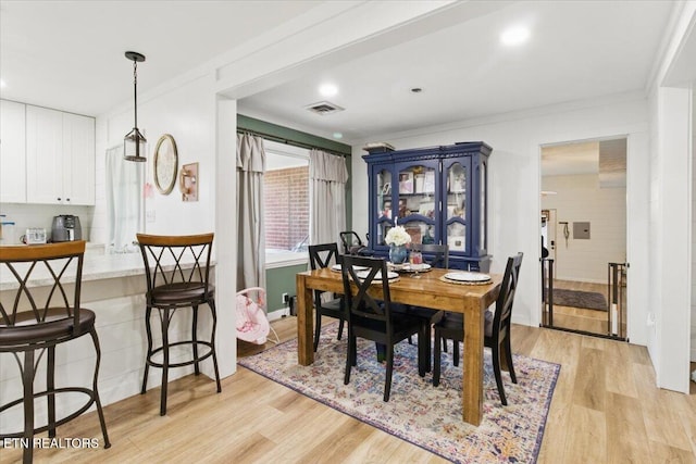 573 Patterson Rd, Harrogate, TN 37752 - dining space with light wood-style floors and ornamental molding