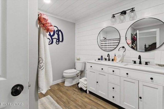 573 Patterson Rd, Harrogate, TN 37752 - bathroom with double vanity, toilet, wood finished floors, wooden walls, and wood ceiling