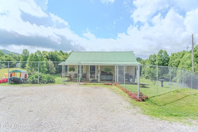 597 Mill Branch Rd, Huntsville, TN 37756 - view of front facade with a metal roof, a gate, and dirt driveway