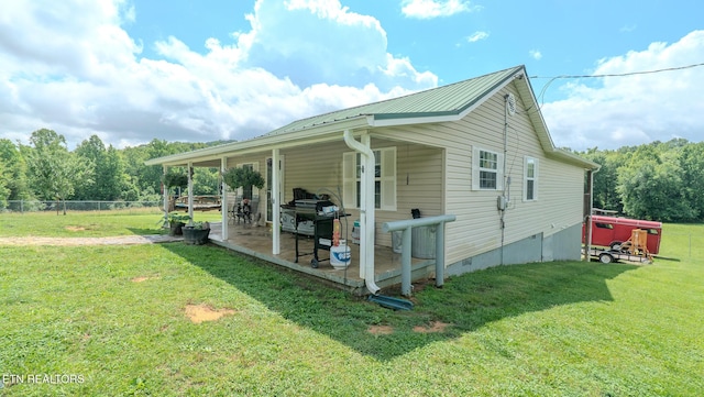 597 Mill Branch Rd, Huntsville, TN 37756 - view of side of property featuring crawl space, a patio area, and a metal roof