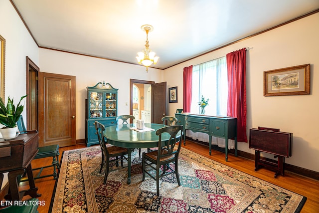 109 Willard St, Maryville, TN 37803 - dining area featuring wood finished floors, a chandelier, crown molding, and baseboards