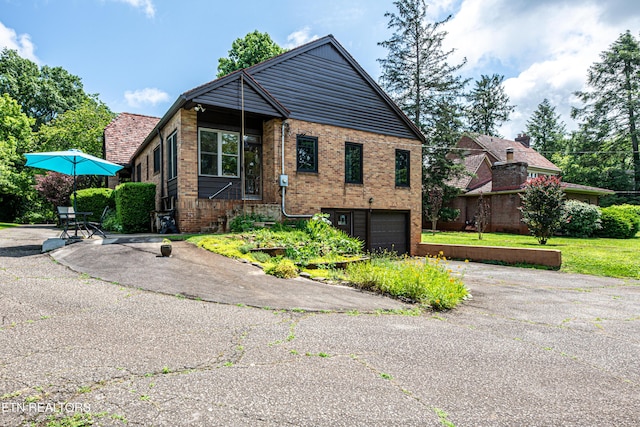 109 Willard St, Maryville, TN 37803 - view of front of property with driveway, brick siding, and a garage