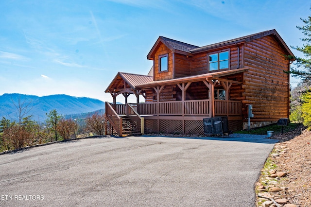 2456 Hackberry Dr, Sevierville, TN 37862 - view of front of house with covered porch, a mountain view, and stairs