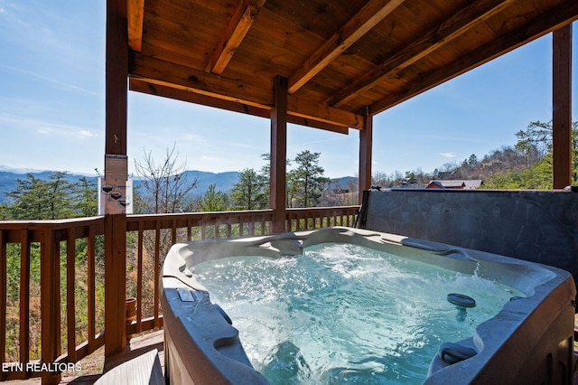 2456 Hackberry Dr, Sevierville, TN 37862 - wooden terrace featuring a hot tub and a mountain view