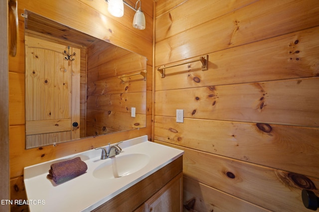2456 Hackberry Dr, Sevierville, TN 37862 - bathroom with wood walls and vanity