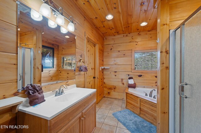 2456 Hackberry Dr, Sevierville, TN 37862 - bathroom featuring vanity, a stall shower, a bath, wood walls, and tile patterned floors