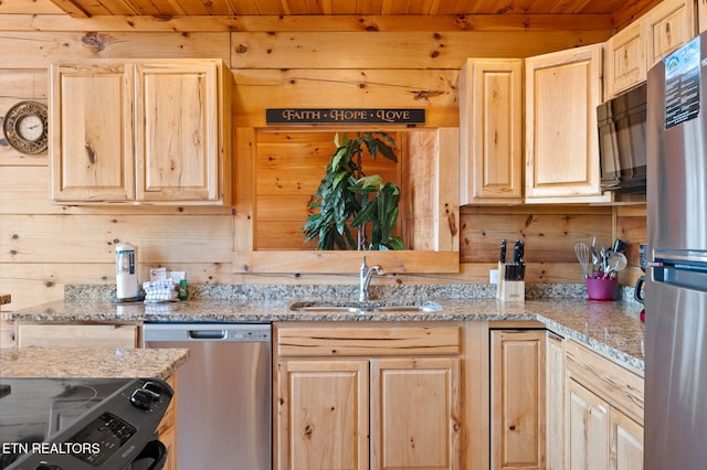2456 Hackberry Dr, Sevierville, TN 37862 - kitchen featuring light brown cabinetry, stainless steel appliances, a sink, wood ceiling, and wood walls