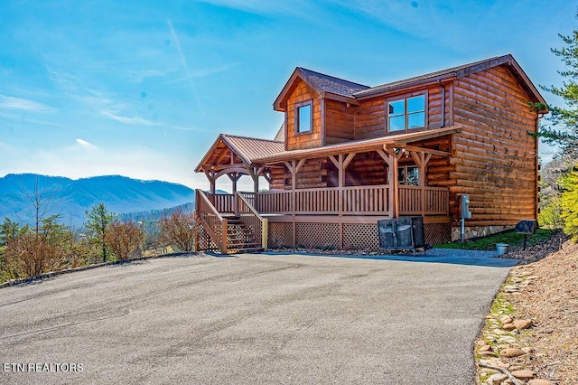 2456 Hackberry Dr, Sevierville, TN 37862 - view of front of property featuring a porch, a mountain view, log siding, and stairway