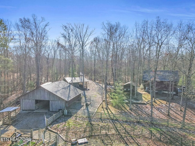 390 John J Smith Rd, Oneida, TN 37841 - back of house with an outbuilding, an exterior structure, and a wooded view
