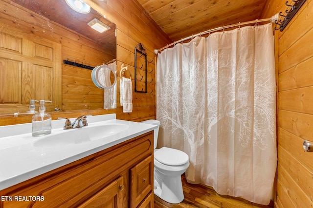 390 John J Smith Rd, Oneida, TN 37841 - full bath featuring wooden walls, vanity, toilet, wood ceiling, and wood finished floors