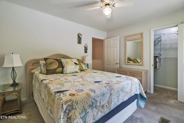 99 Wilshire Heights Dr Unit 99, Crossville, TN 38558 - carpeted bedroom with a spacious closet, a closet, baseboards, and ceiling fan