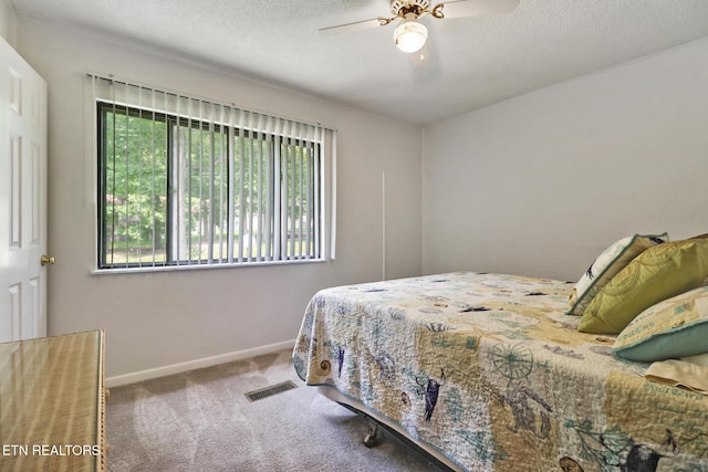 99 Wilshire Heights Dr Unit 99, Crossville, TN 38558 - carpeted bedroom with baseboards, a textured ceiling, and a ceiling fan
