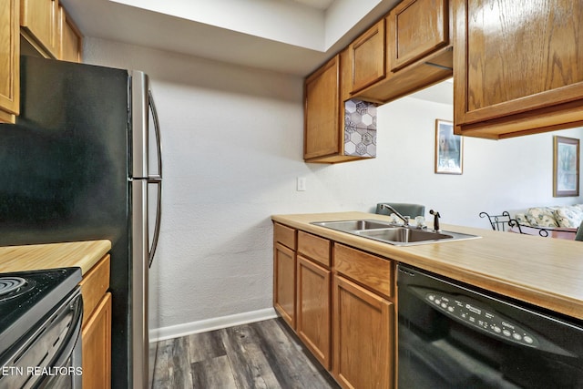 99 Wilshire Heights Dr Unit 99, Crossville, TN 38558 - kitchen featuring black dishwasher, dark wood-style floors, a sink, baseboards, and light countertops