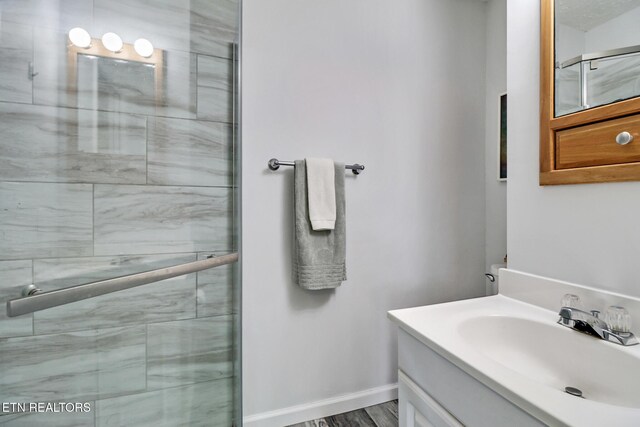 99 Wilshire Heights Dr Unit 99, Crossville, TN 38558 - bathroom featuring vanity, tiled shower, and baseboards