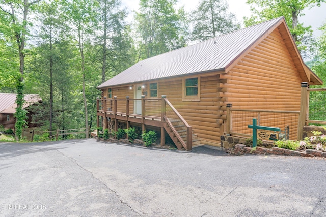 1646 Misty Hollow Way, Gatlinburg, TN 37738 - view of front of property with log exterior, metal roof, and a wooden deck