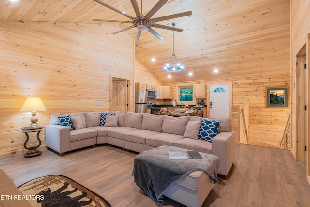 1646 Misty Hollow Way, Gatlinburg, TN 37738 - living room with wooden ceiling, wood walls, light wood finished floors, ceiling fan, and high vaulted ceiling